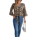Women's business casual chiffon top with tie neck.