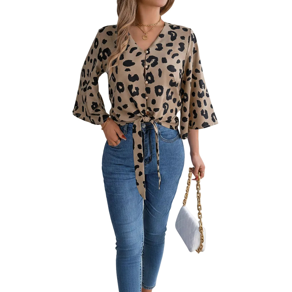Women's business casual chiffon top with tie neck.