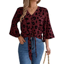 Women's chiffon leopard print blouse with elegant tie neck.