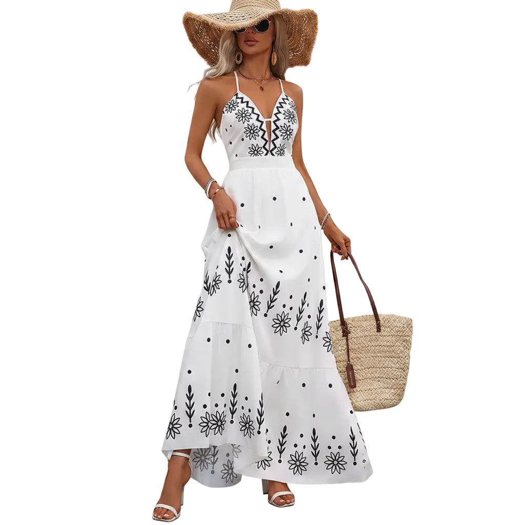 Women's floral halter neck open back maxi dress front view.