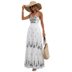 Women's open back floral maxi dress with flowing silhouette.